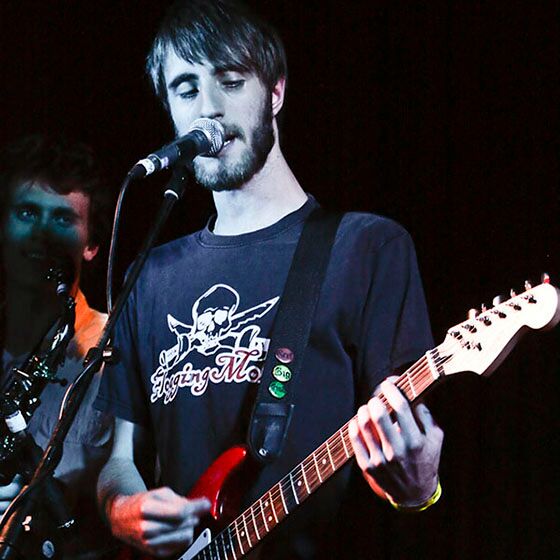 Man playing guitar on stage